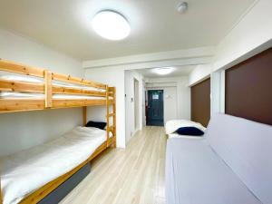 Giường trong phòng chung tại Sunrise Mansion - Vacation STAY 14387