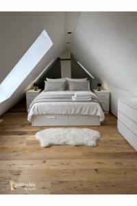 a bedroom with a bed and a large window at Loft in Toplage in Paderborn +8 photos