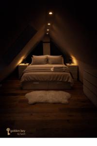 a bedroom with a bed in a dark room at Loft in Toplage in Paderborn