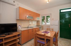 Kuchyň nebo kuchyňský kout v ubytování Apartments Krvavica