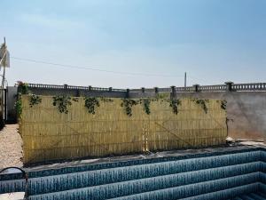 a set of stairs with a yellow fence at Da Sukoon in Pachār