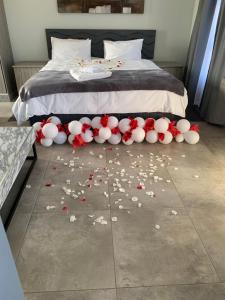 a bed with a bunch of flowers on the floor at Florencepalms resort & Spa in Marble Hall