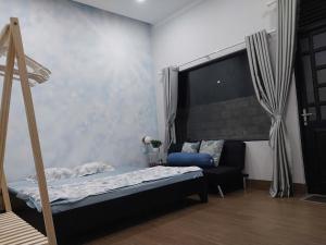 Giường trong phòng chung tại Home Nam Phương -Bảo Lộc