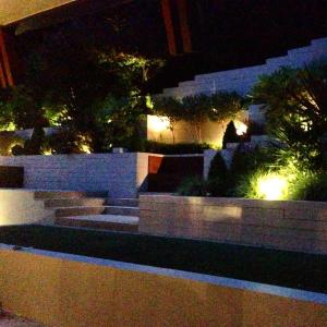 a view of a garden at night with lights at Luxury Double Room in Chislehurst