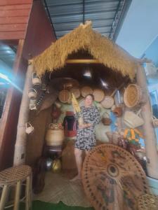 a man standing inside of a play house at BOUAKHAI HOTEL Pakbeng in Pakbeng