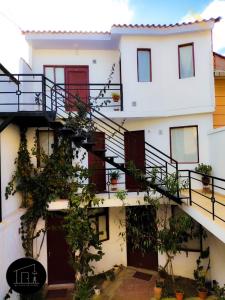 a building with stairs and plants at Mi casa en Sucre in Sucre