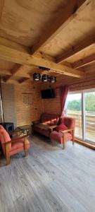 a living room with two couches and a couch at Cabañas Donde Gaspar in Dalcahue