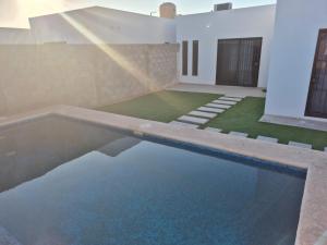 a swimming pool in a house with water in it at casa estefania in San Carlos