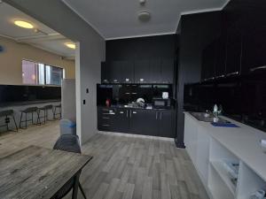 Køkken eller tekøkken på SpinCity Lodge Auckland