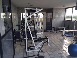 a room with a gym with a ladder and chairs at Flat Manaira, lado do Manaira Shopping in João Pessoa