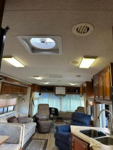an interior view of an rv with a living room at Comfortable and cozy RV in Lehigh Acres
