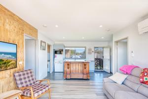 a living room with a couch and a chair at Lees Dream in Venus Bay