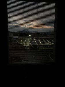 a window in a room with a view of a city at The Magical Garden in Cali +4 photos
