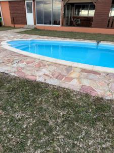 a swimming pool in front of a house at Lodge Plateau 2 in La Possession