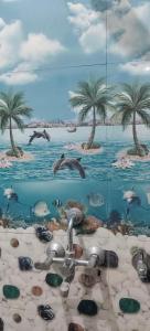 a painting of a beach with palm trees and a sink at Shanti palace and restaurant Ayodhya 1500 mtr Sri Ram Mandir ,near ayodhya dham railway station in Ayodhya