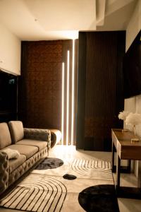 a living room with a couch and a table at Hillzone View in Kingston