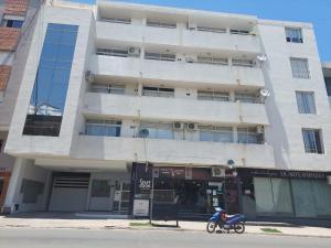 a motorcycle parked in front of a building at Mirasol in Villa Carlos Paz