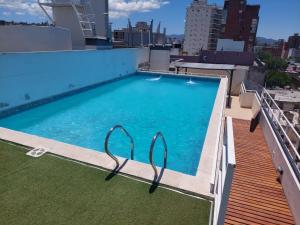 a swimming pool on the roof of a building at Mirasol in Villa Carlos Paz