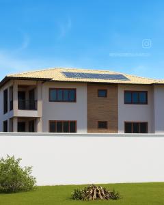 a house with a solar panel on its roof at Espaço Verão Vermelho in Cabo Frio +10 photos