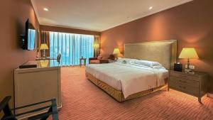 Televizorius ir (arba) pramogų centras apgyvendinimo įstaigoje Similan Hotel Zhuhai-Gongbei Port