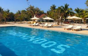 a swimming pool with chairs and umbrellas at a resort at SoonNoeng Resort in Koh Rong Sanloem +67 photos