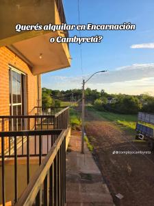 an entrance to a house with a fence at Complejo Cambyreta in Encarnación +5 photos