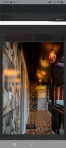 Un televizor și/sau centru de divertisment la Rainforest Holiday Inn