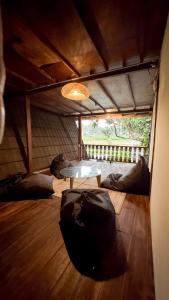 a room with two beds and a table in it at Patria Villa Turi in Soprayan +25 photos