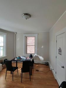 a room with a table and chairs and a window at Shared Salem Apt for staying in a bed in Salem
