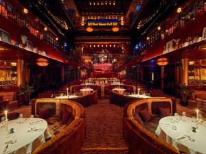 a restaurant with tables and chairs in a room at Aliée Istanbul - A Paris Society Collection Hotel in Istanbul