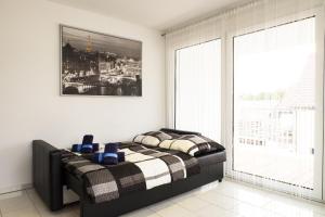 Säng eller sängar i ett rum på Design Apartment Metzingen