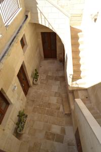 an overhead view of a hallway in a building at Corte Kalìnora in Martano