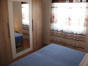 Postel nebo postele na pokoji v ubytování Apartments Niksa