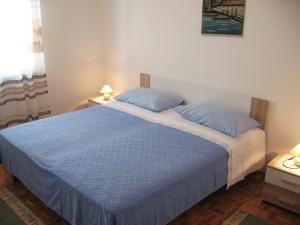 Postel nebo postele na pokoji v ubytování Apartments Niksa
