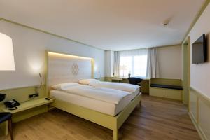 Postel nebo postele na pokoji v ubytování Hotel Krone Speicher + 37 fotografií