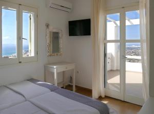 
A bed or beds in a room at Villas Naxos Grande Vista
