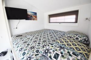 Postel nebo postele na pokoji v ubytování Vakantiepark de Meerpaal