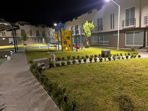 a park with a playground in a building at night at La Casa de Coco in Oacalco
