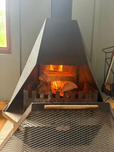 a grill with some food cooking in it at Elephant loft in Stormsrivier