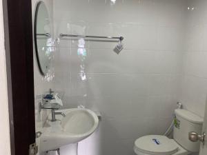 a white bathroom with a sink and a toilet at Chiang Mai view place in Ban Hua Phrong