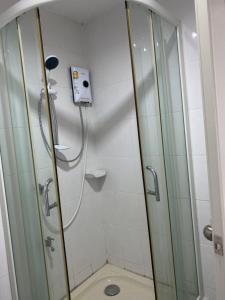a shower with a glass door in a bathroom at Chiang Mai view place in Ban Hua Phrong