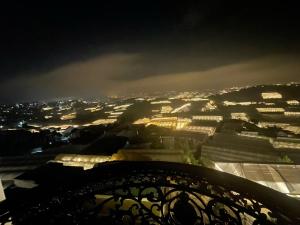 a view of a city lit up at night at Gold Villa in Trai Mat