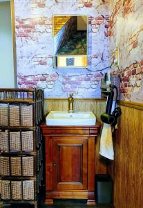 a bathroom with a sink and a mirror at Kirisame Magic Shop霧雨魔法店民泊伊勢市 in Ise +33 photos