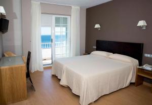 Posteľ alebo postele v izbe v ubytovaní Hotel Luz de Luna + 24 fotografií