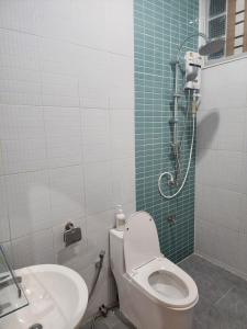 a bathroom with a toilet and a sink at 198 House in Ban Khlong Pleo +59 photos