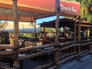 a restaurant with a sign that reads drop in bar at Vontzos Hotel in Achladies