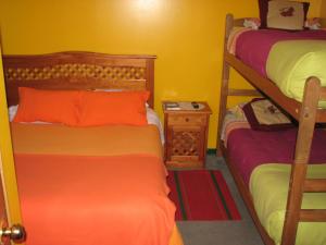 A bed or beds in a room at Hostal El Mirador