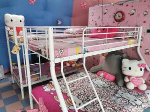 a bedroom with two bunk beds with pink walls at Groups & Families Glamping Dome Beach Resort Dauin in Dauin +4 photos