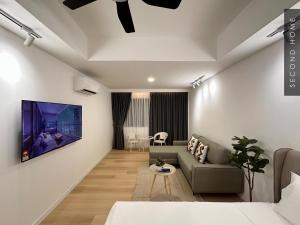 a living room with a couch and a table at Second Home - Kota Kemuning in Shah Alam