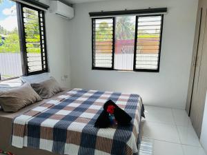 En eller flere senge i et værelse på Residence 50 Apartment Nausori + 8 billeder